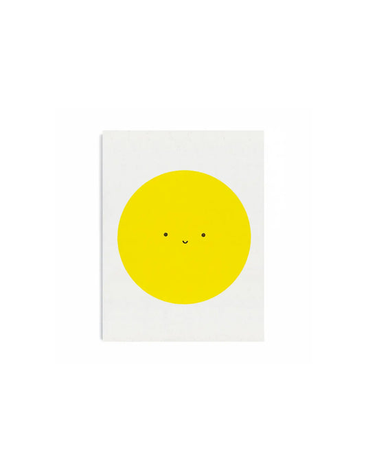 Yellow circle with a smiley face on a white background