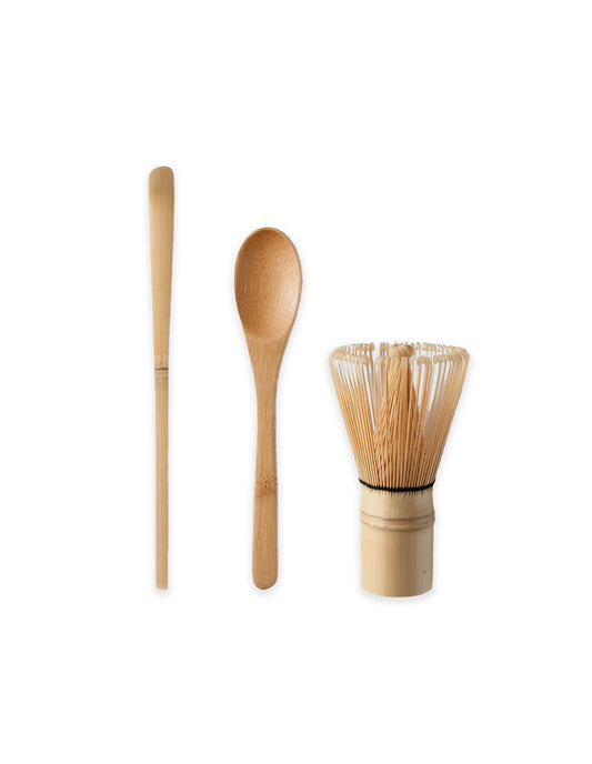 Set of three bamboo kitchen utensils on a white background