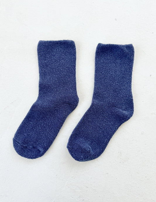 Pair of blue socks on a white background