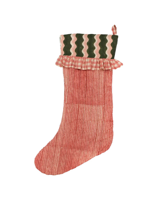 Red checkered Christmas stocking with green and pink striped top on a white background