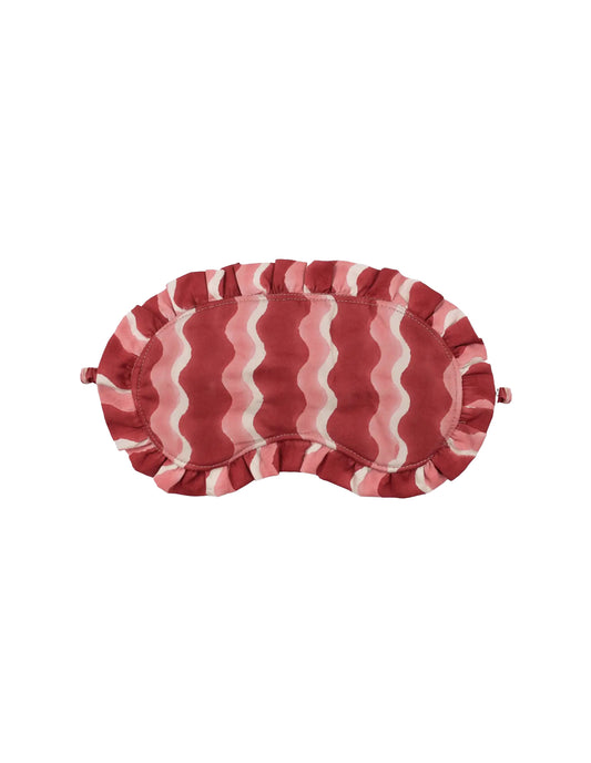 Red and white striped eye mask on a white background