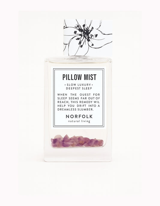 Pillow mist product with label and decorative elements on a white background