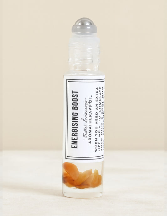 Roll-on bottle labeled 'Energising Boost' on a beige background