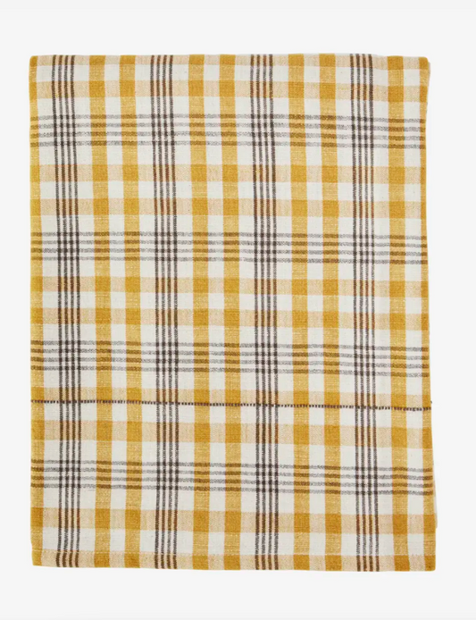 Plaid blanket with yellow and white pattern on a white background